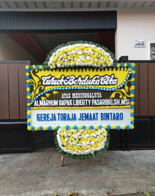 Papan Bunga Duka di Toho